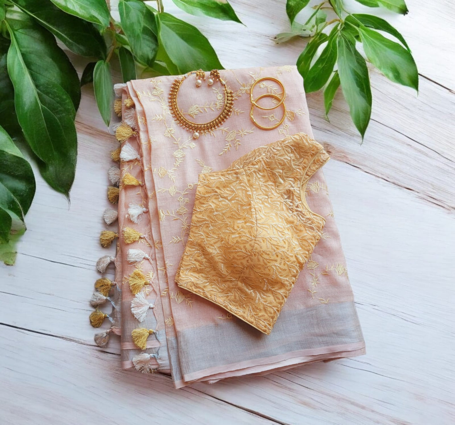 Linen Saree with Stitched net Embroidered Blouse